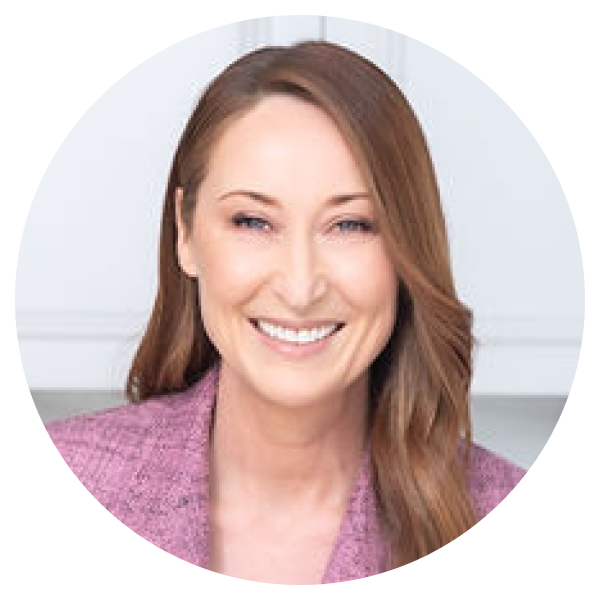 Close up of Mel Browne smiling at the camera.